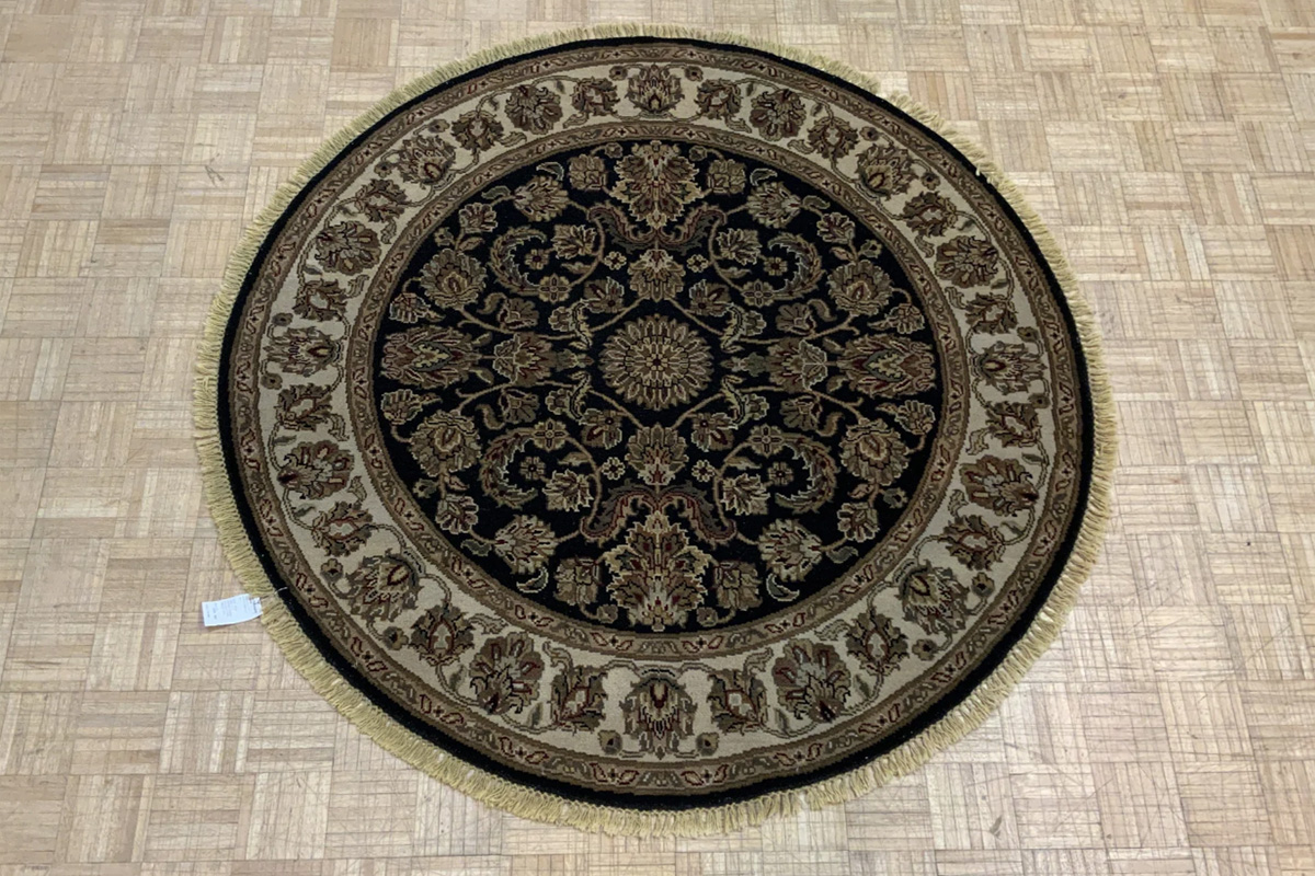 Read more about the article Anchor Ottomans with a Round Rug
